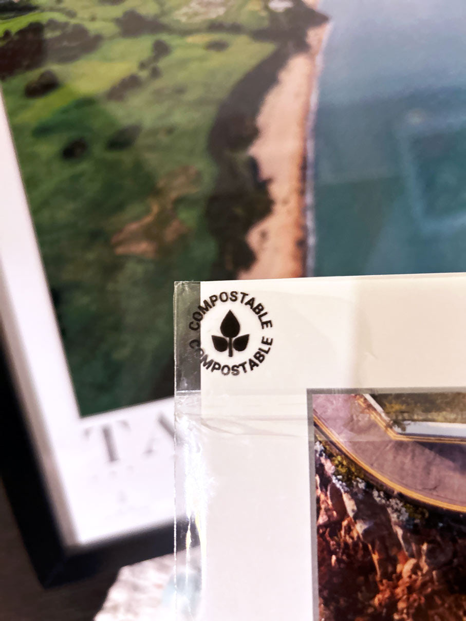 Close up of the symbol sayinh compostable on the packaging of the Love your Spot prints